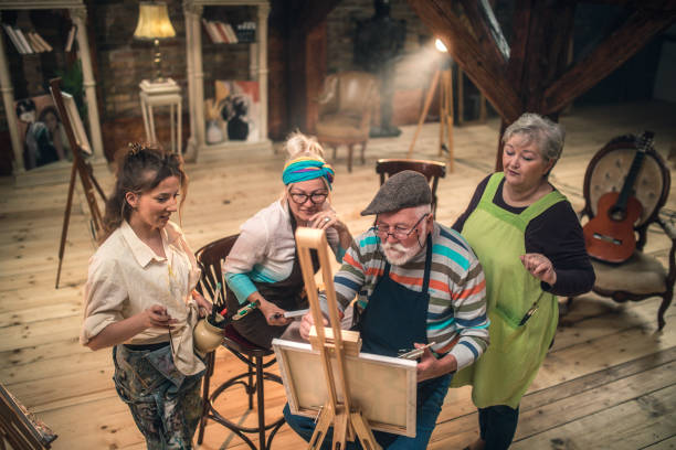 istock group of seniors attending art class with teacher 1488285167