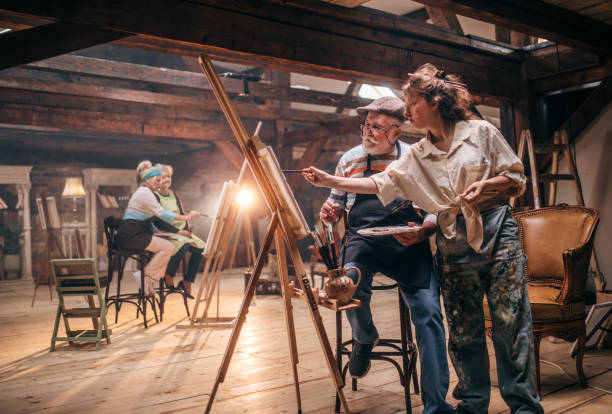istock group of seniors attending art class with teacher 1488285189