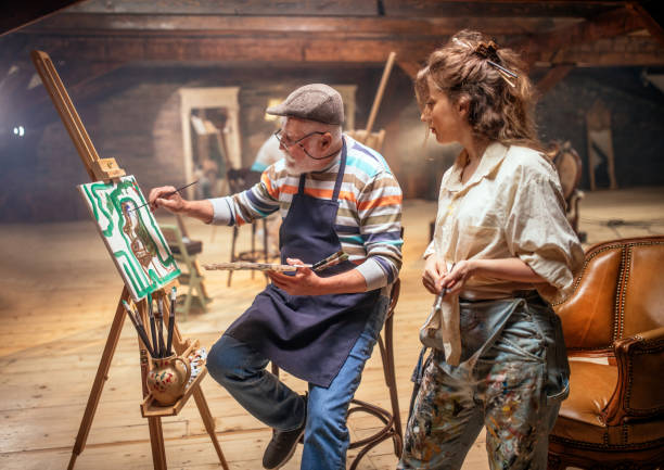 istock group of seniors attending art class with teacher 1488285190