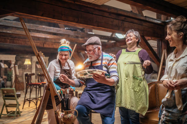 istock group of seniors attending art class with teacher 1488285207
