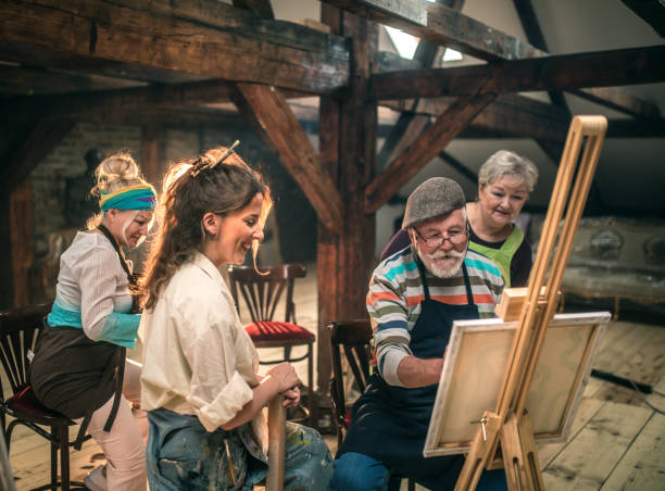 istock group of seniors attending art class with teacher 1488285209