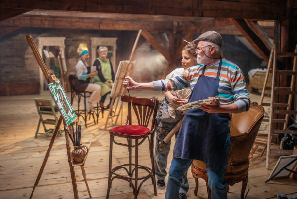 istock group of seniors attending art class with teacher 1488285224