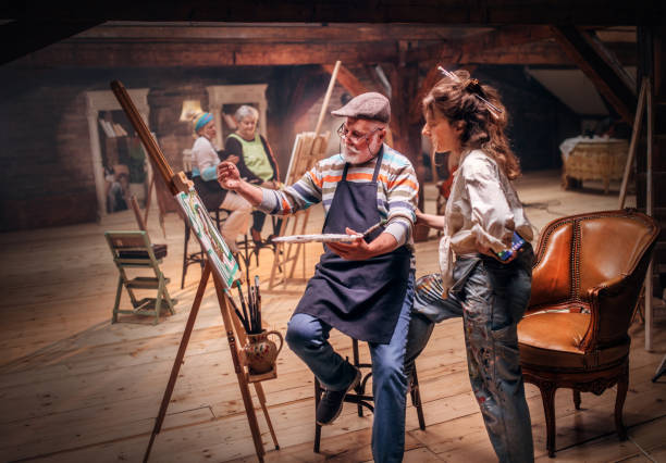 istock group of seniors attending art class with teacher 1488285245