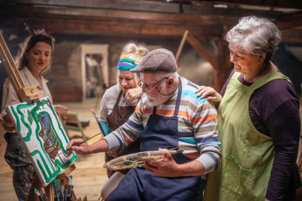 istock group of seniors attending art class with teacher 1488285248