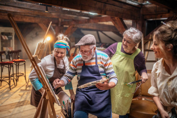 istock group of seniors attending art class with teacher 1488285269
