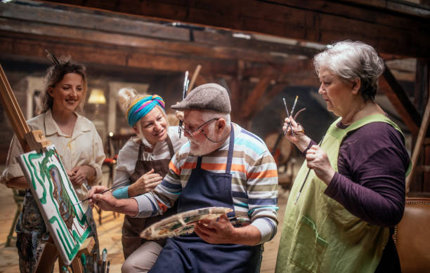 istock group of seniors attending art class with teacher 1488285280