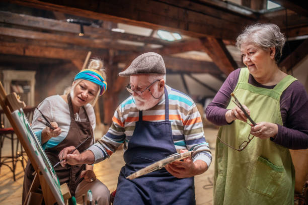istock group of seniors attending art class with teacher 1488285285