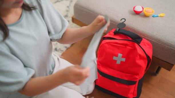 istock Woman preparing emergency bag at home 1488288543