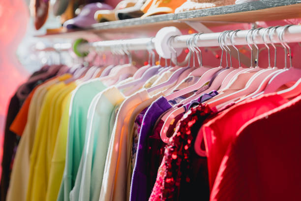 istock Colorful Vibrant Clothing Rack at a Thrift Store 1488288568
