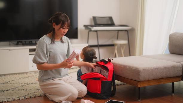istock Woman preparing emergency bag at home 1488288580