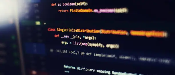 Photo of Abstract computer script code. Programming code screen of software developer.