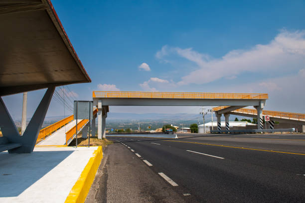 istock View of the road with pedestrian bridge. 1488288727