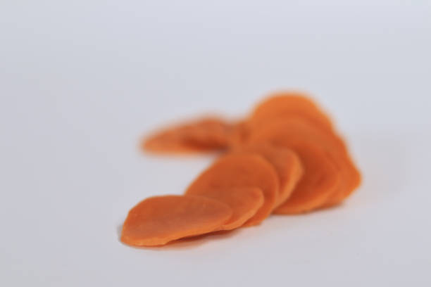 istock Raw crackers are orange in color on a white background 1488290985