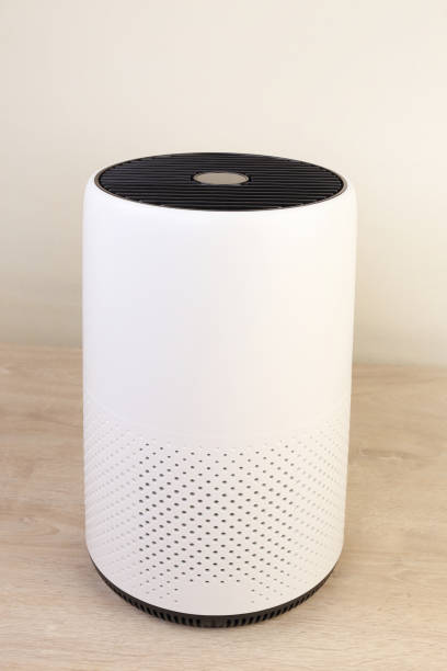 istock White air purifier on wooden floor 1488293645