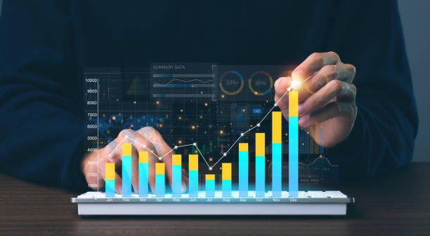 istock Businessman using tablet analyze sales data and economic growth graph chart and report with KPI and metrics connected to the database. Business planning and strategy.Technology digital marketing. 1488294036