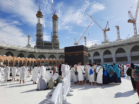Pilgrims from different countries of the world are performing Tawaf in the courtyard of Masjid al-Haram in Mecca during the day.