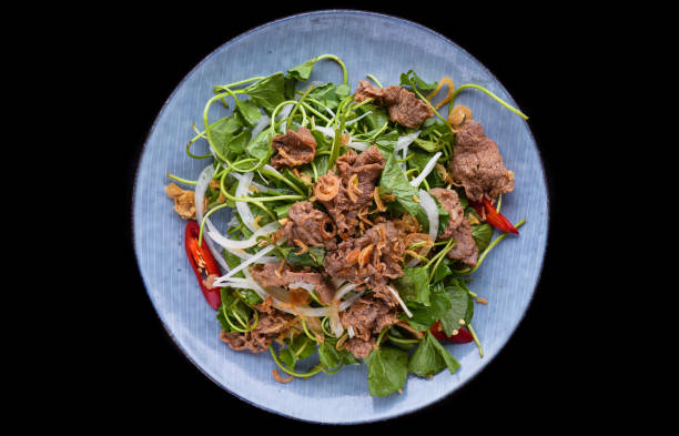 istock Vietnamese stir fried chayote with beef isolated on black background 1488295074