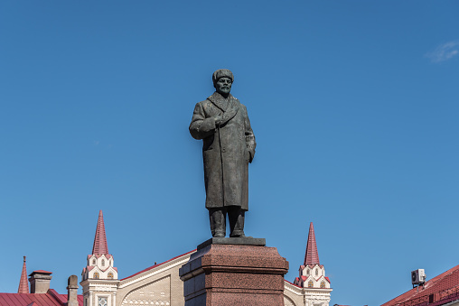 Monument to Lenin in the background of a cloudless sky. Lenin - leader of the socialist revolution in Russia in 1917. Rybinsk, Russia -May 2, 2023.