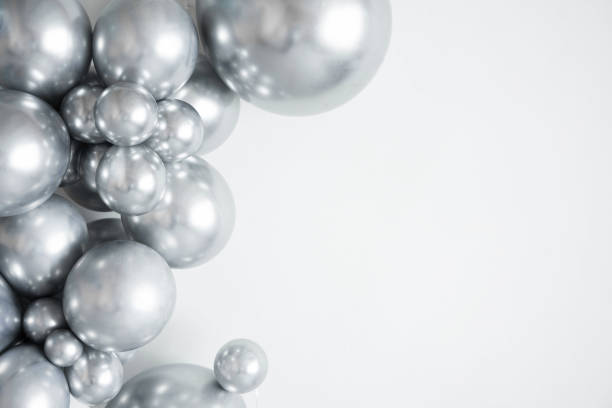 istock Silver balloons on a white background with copy space. 1488297264
