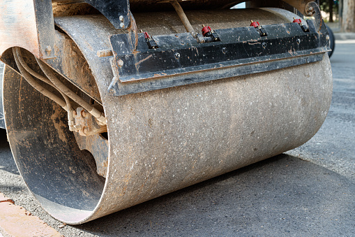 Partial close-up of road roller
