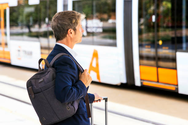 istock Business man waiting for the train 1488298333