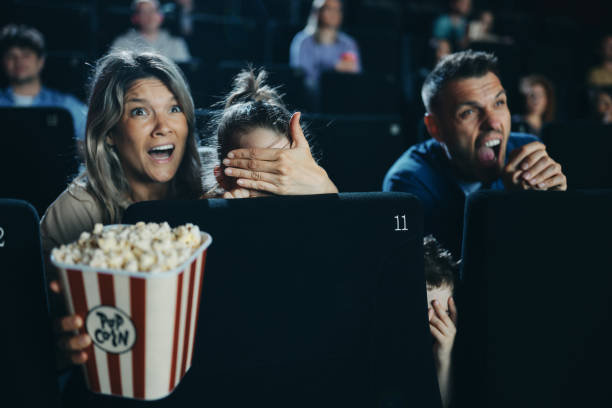 istock Don't look sweetie, it's a horror movie! 1488299628
