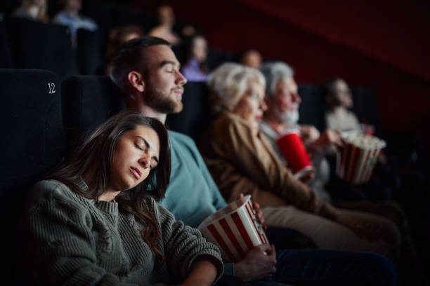 istock Sleeping during a boring movie in theatre! 1488300829
