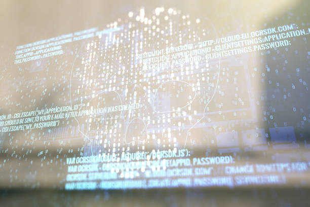 istock Double exposure of abstract virtual creative code skull hologram on modern business center exterior background. Malware and cyber crime concept 1488300954
