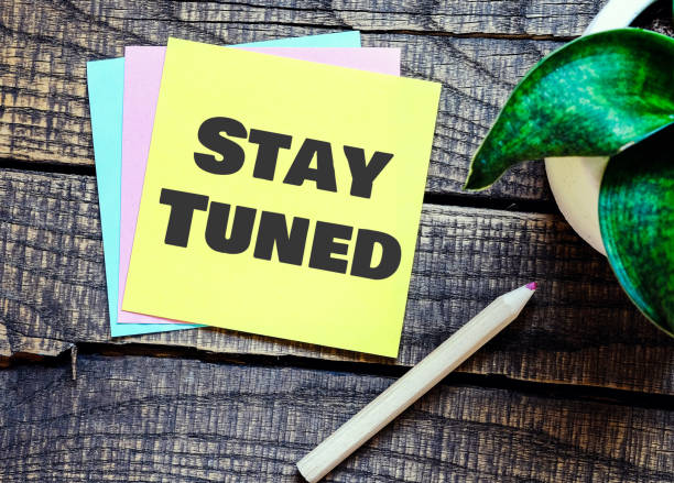 istock STAY TUNED words on a small piece of paper. 1488301217