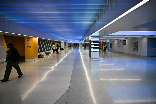 New York City, United States, April 9, 2023 - Connecting walkway and access to the Amtrak Rail Road platforms of Penn Station below the James A. Farley Post Office in Midtown Manhattan, New York.