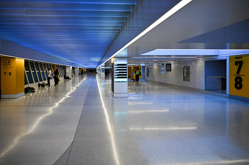 New York City, United States, April 9, 2023 - Connecting walkway and access to the Amtrak Rail Road platforms of Penn Station below the James A. Farley Post Office in Midtown Manhattan, New York.