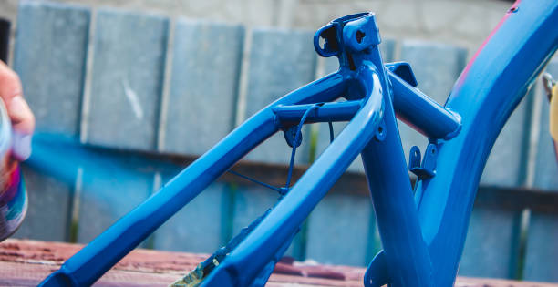 istock a man paints a bicycle with spray paint. 1488306636