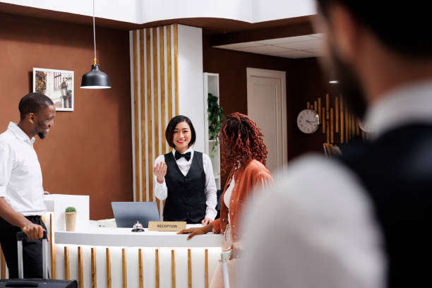 istock Receptionist talking to hotel guests 1488306911