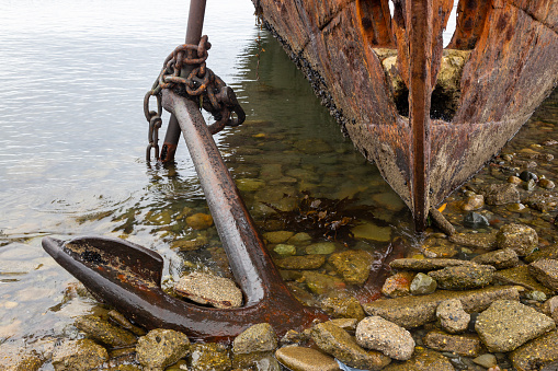 Close up of old Rusted Ship Anchor. Lord Lonsdale Shipwreck Hull on Strait of Magellan, Punta Arenas Chilean Patagonia Coast