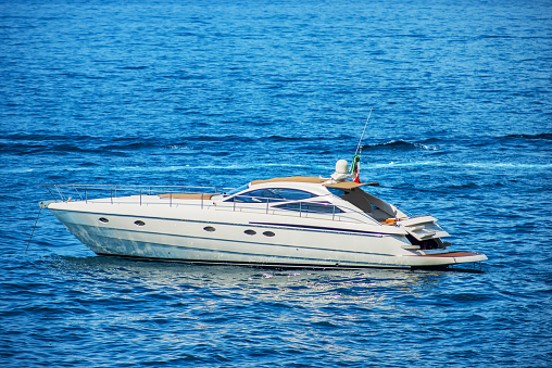 White luxury motor boat moored in the Mediterranean Sea, Gulf of La Spezia, Liguria, Italy, southern Europe.