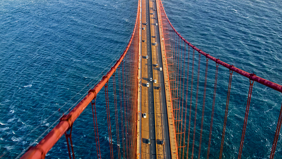 Aerial view of traffic moving on Golden Gate Bridge in San Francisco, California, USA.