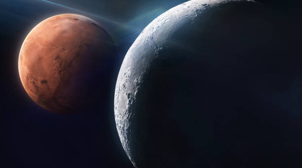 istock Moon and Mars in black space. Red planet on background. Lunar orbit. Moon surface with dark side. Mission of Orion spacecraft concept. Elements of this image furnished by NASA 1488309530