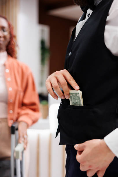 istock Bellboy accepting cash from people 1488309631