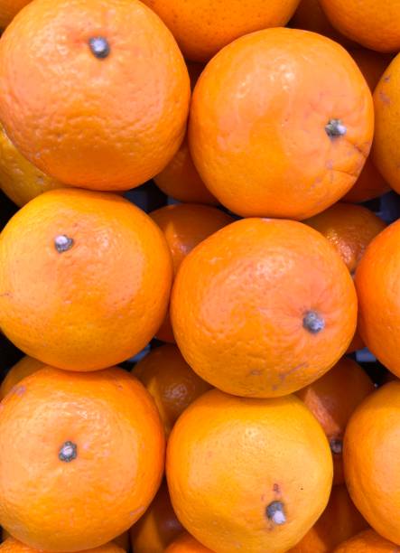 istock Fresh oranges on the supermarket shelf 1488310845