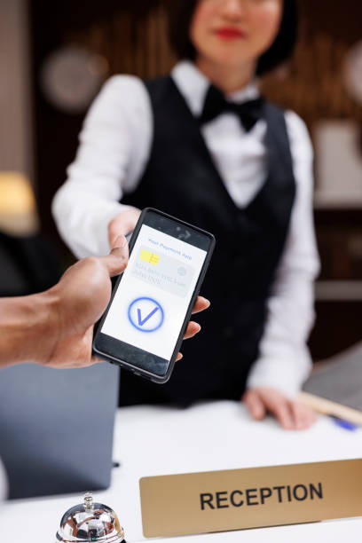 istock Guest paying with nfc on phone at pos 1488310856