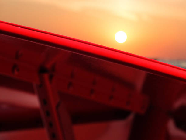 metal parasol with sunset in the background