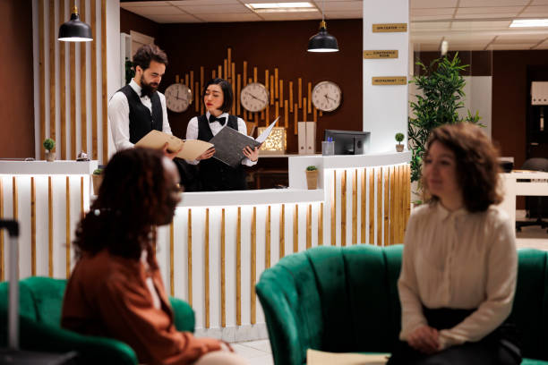 istock Hotel team reading record of check in 1488312507