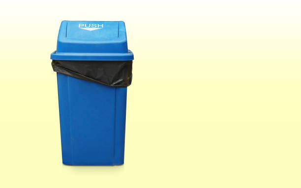 istock front view black bag in the blue bin and lid plastic on gradient green and white background, object, clean, vintage, decor, keep, copy space 1488313521