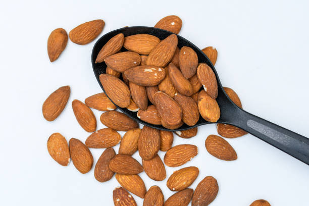 istock California almonds with peel on a black kitchen spoon 1488313999