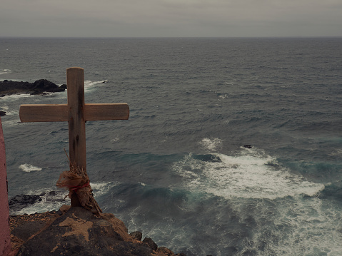 Wooden cross over the sea