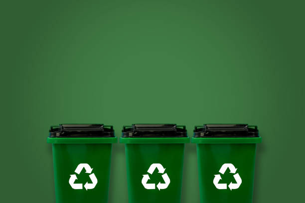 istock Plastic green into the recycling bin For plastic, ecological glass, and paper copy space, green background 1488315424
