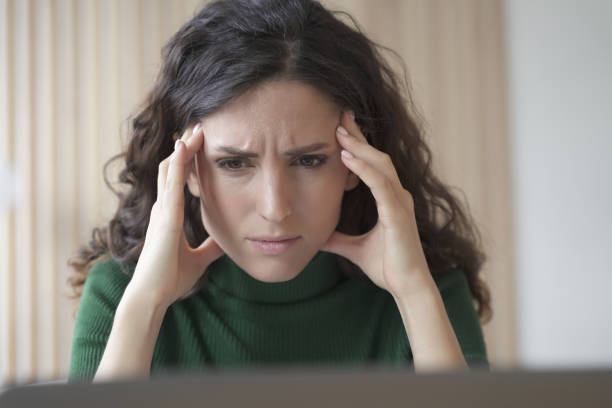 istock Concerned young italian woman employee looking at computer screen with frustrated face expression 1488315575