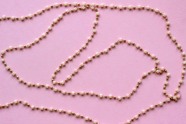 Background for needlework and jewelry, DIY. chain with beads. Blur effect. Weak focus. Background for needlework and jewelry, DIY. chain with beads. Blur effect. Weak focus. chain stitch embroidery stock pictures, royalty-free photos & images