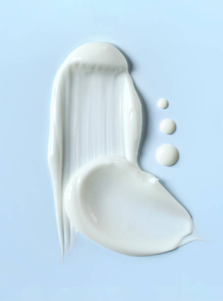 istock cosmetic smears cream texture on pastel blue background 1488316779