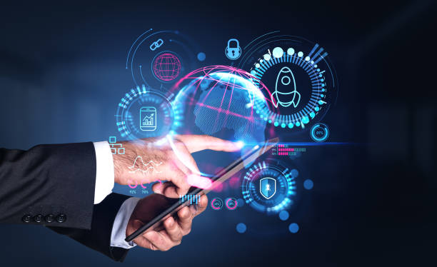istock Businessman wearing formal wear holding tablet device with digital interface 1488318790